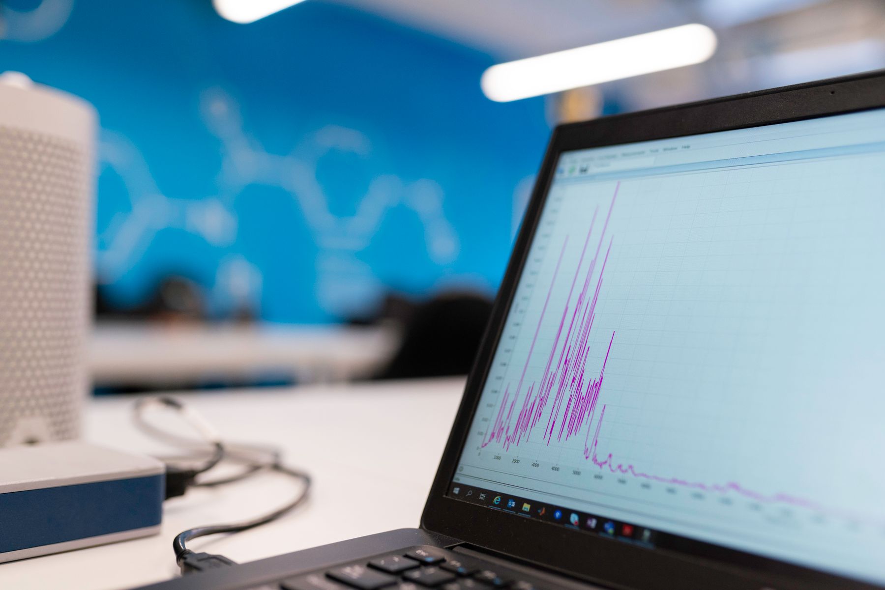 Laptop displaying a detailed performance graph in an analytics workspace